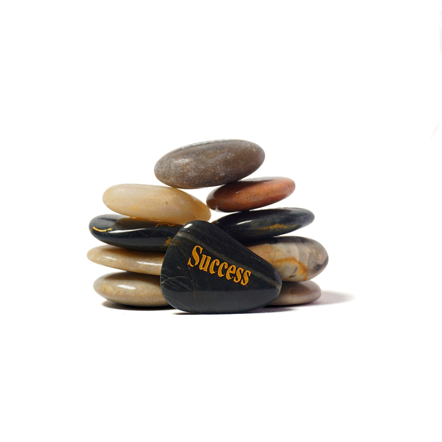 Stack of stones with 'Success' engraved on one of them against a white background