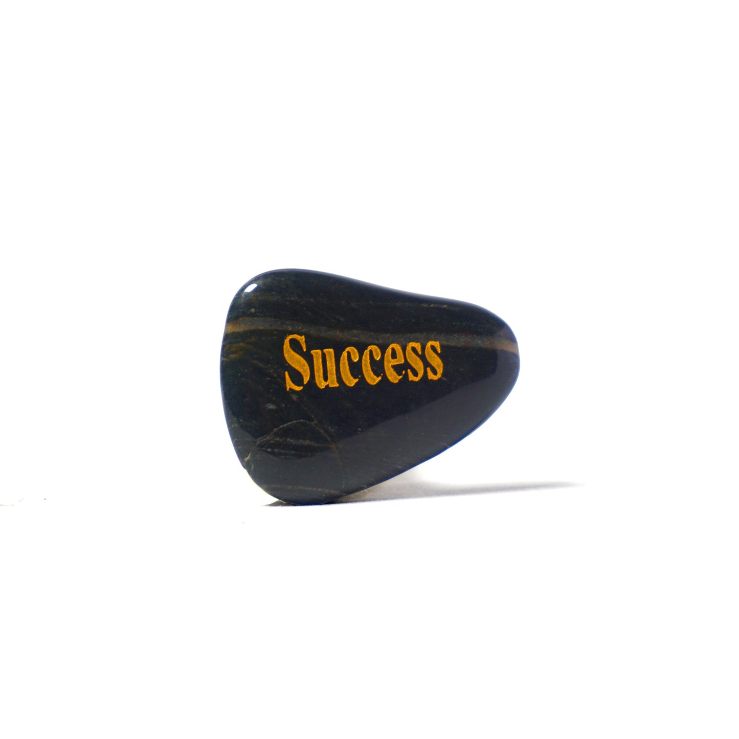 Black stone with 'Success' engraved on a white background