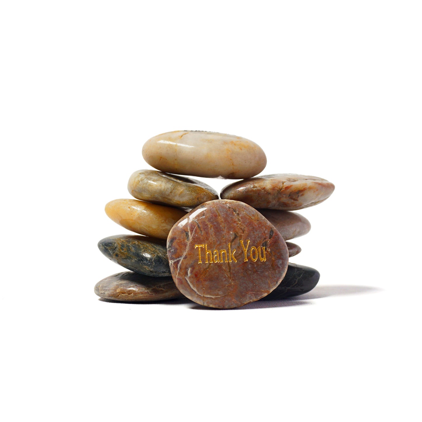 Stack of stones with 'Thank You' engraved on a white background