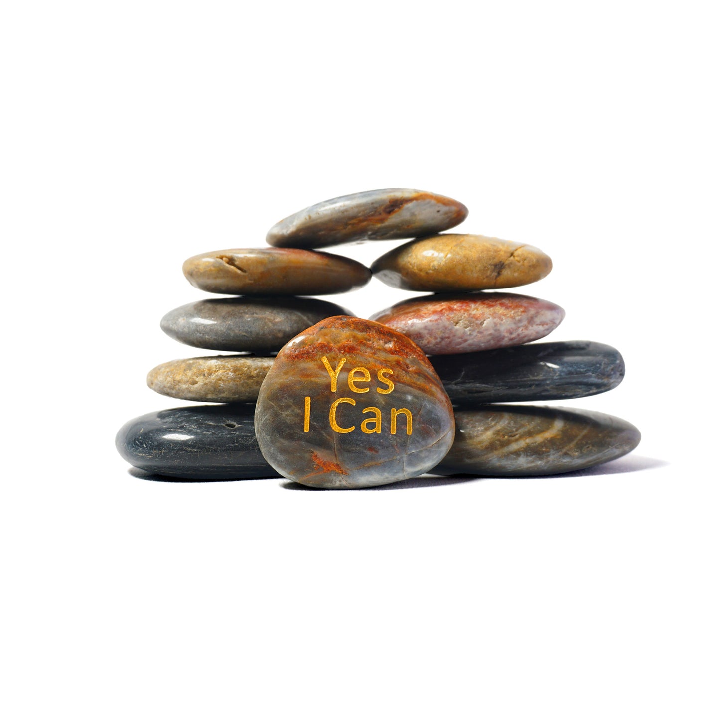 Stack of stones with 'Yes I Can' text on a white background