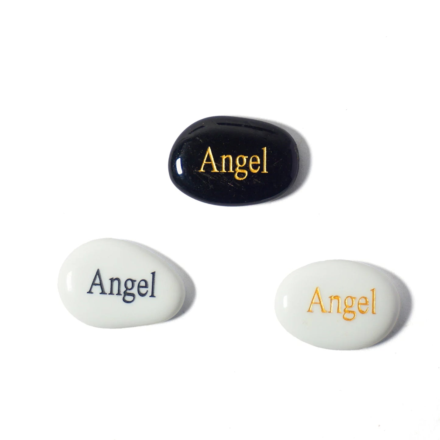 Three stones with 'Angel' engraved on them, two white and one black, on a white background.