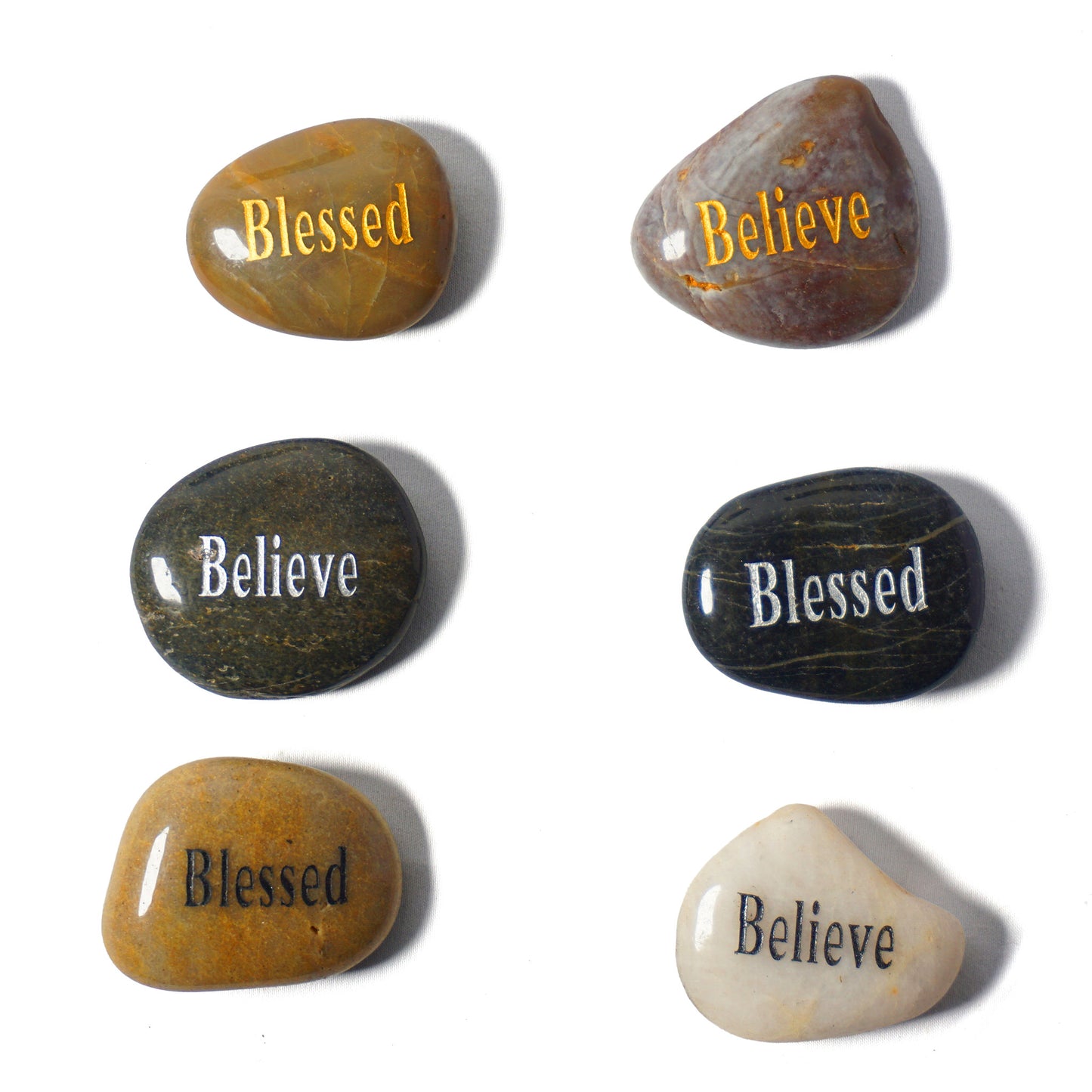 Set of six stones with 'Blessed' and 'Believe' inscriptions on a white background