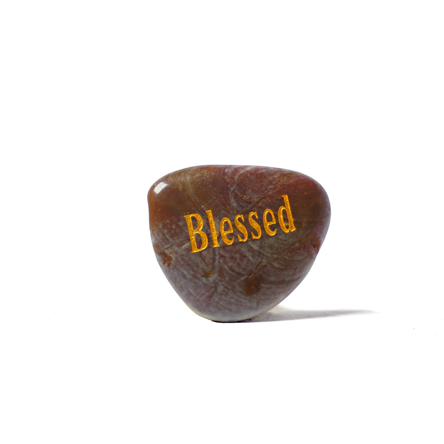 Brown stone with 'Blessed' engraved on a white background