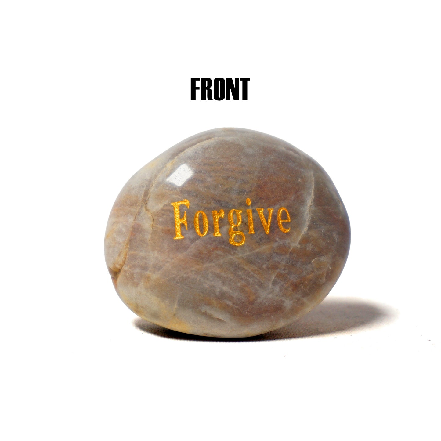 Stone with 'Forgive' engraved on a white background