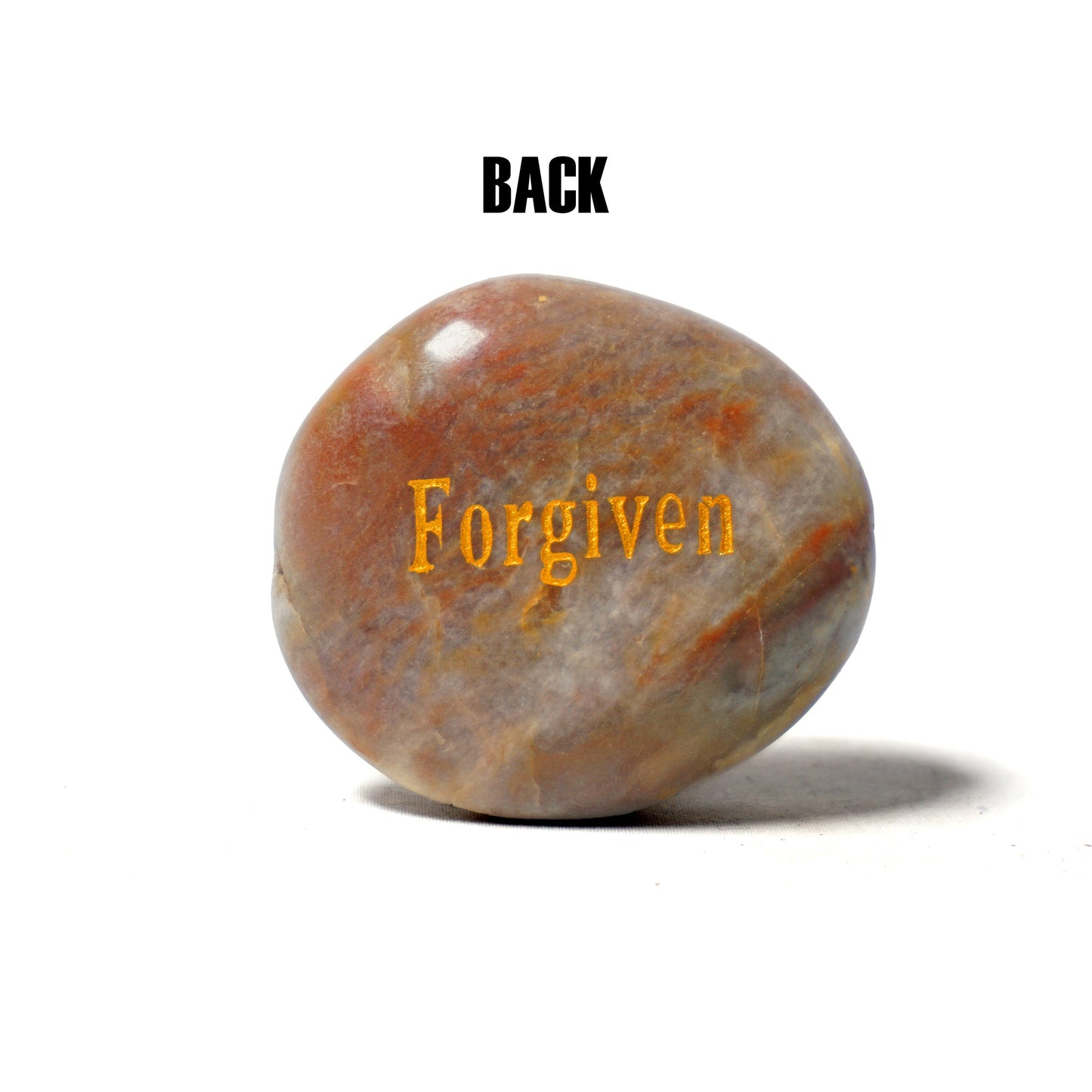 Brown stone with 'Forgiven' engraved on a white background