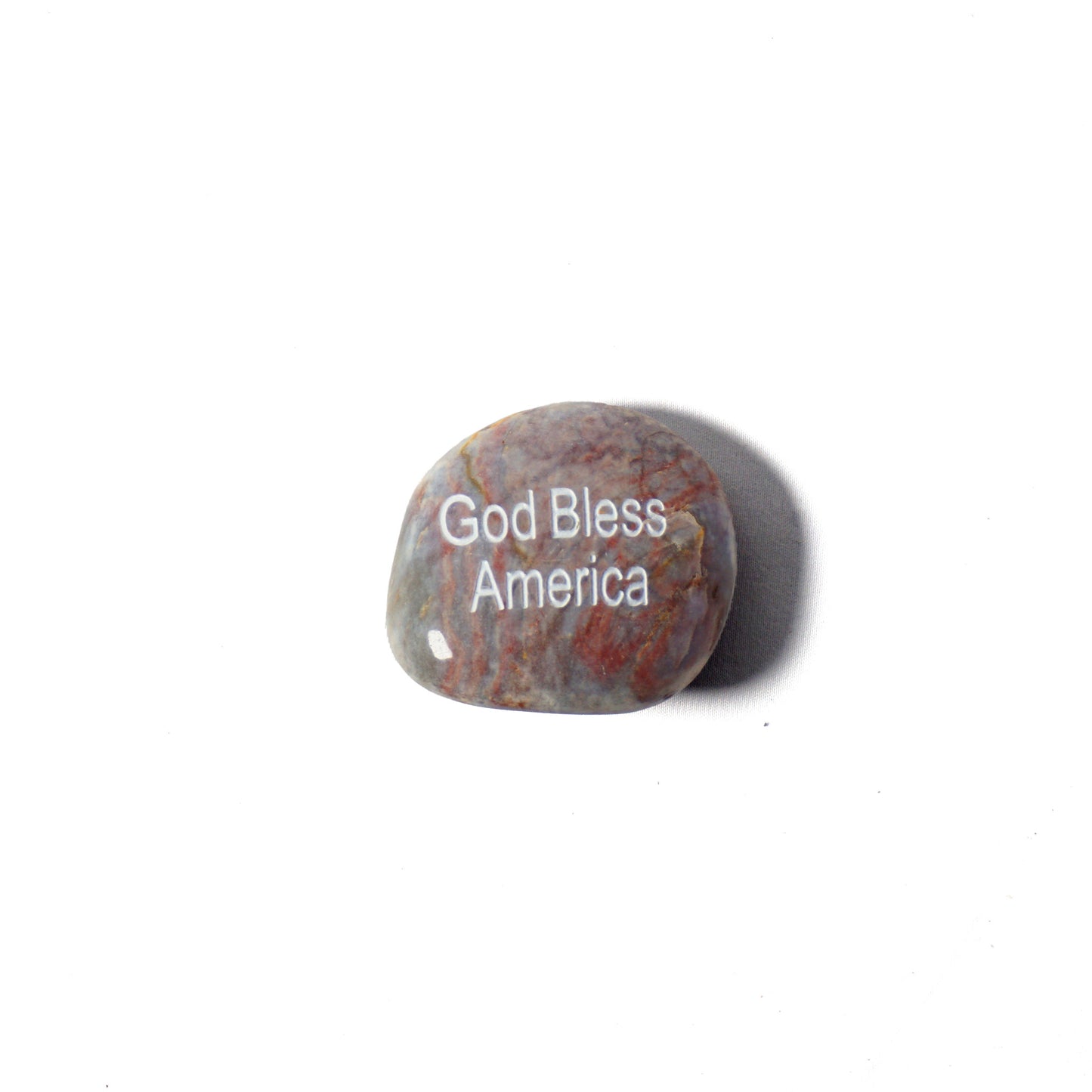 Decorative stone with 'God Bless America' text on a white background