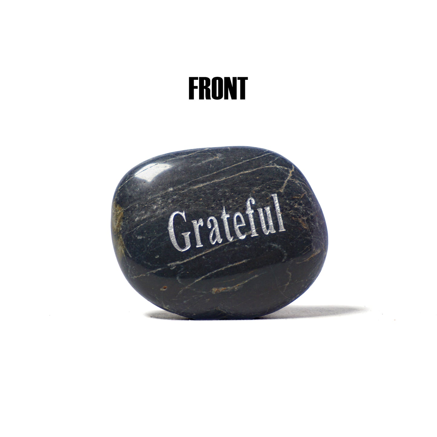 Black stone with 'Grateful' engraved on a white background
