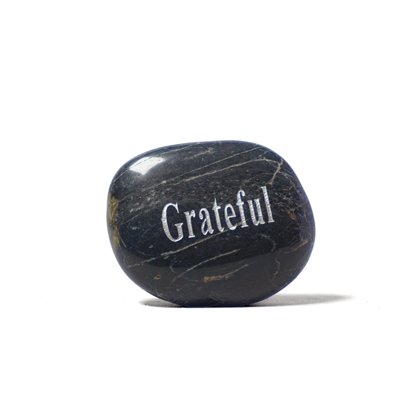 Black stone with 'Grateful' engraved on a white background