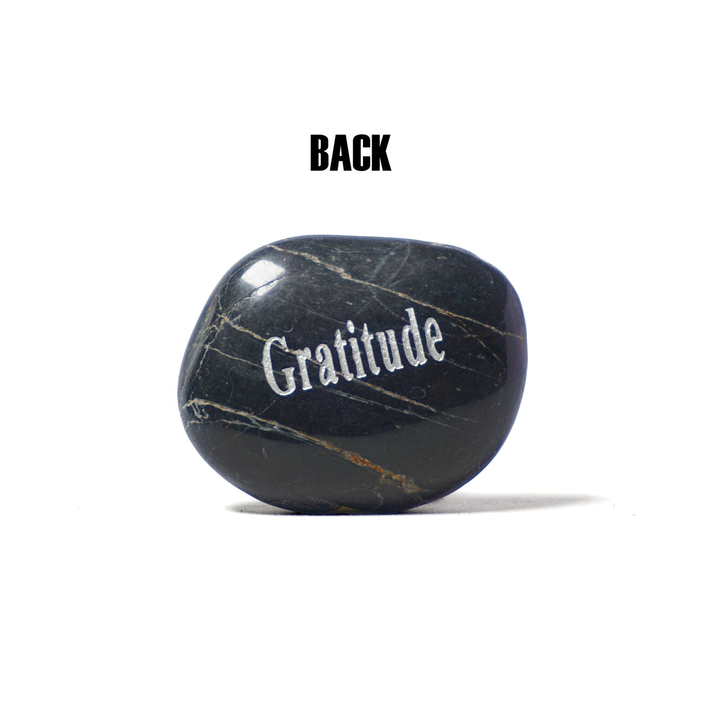 Black marble stone with 'Gratitude' engraved on a white background