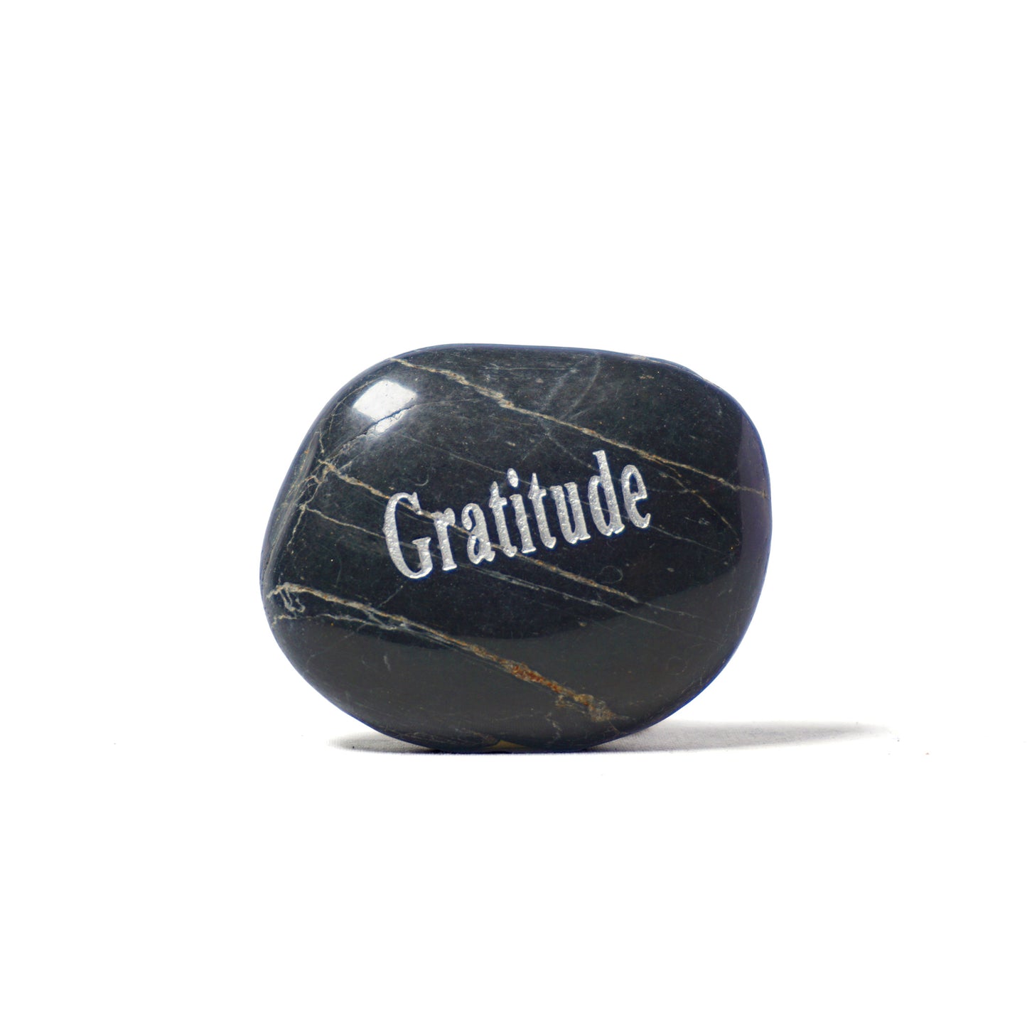 Black marble stone with 'Gratitude' engraved on a white background