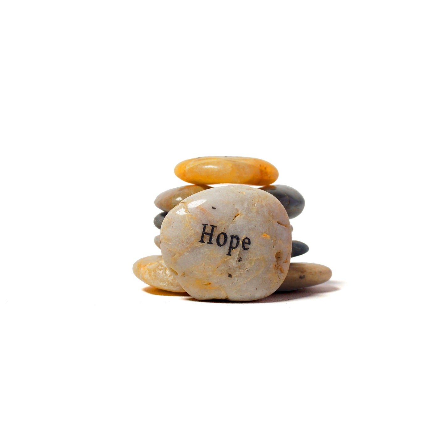 Stack of stones with a prominent stone labeled 'Hope' on a white background