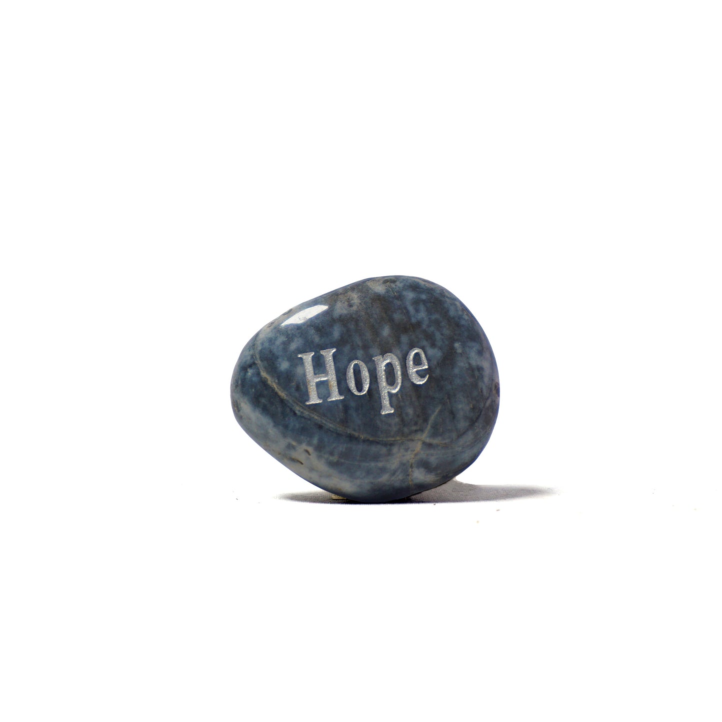 Blue stone with 'Hope' engraved on a white background