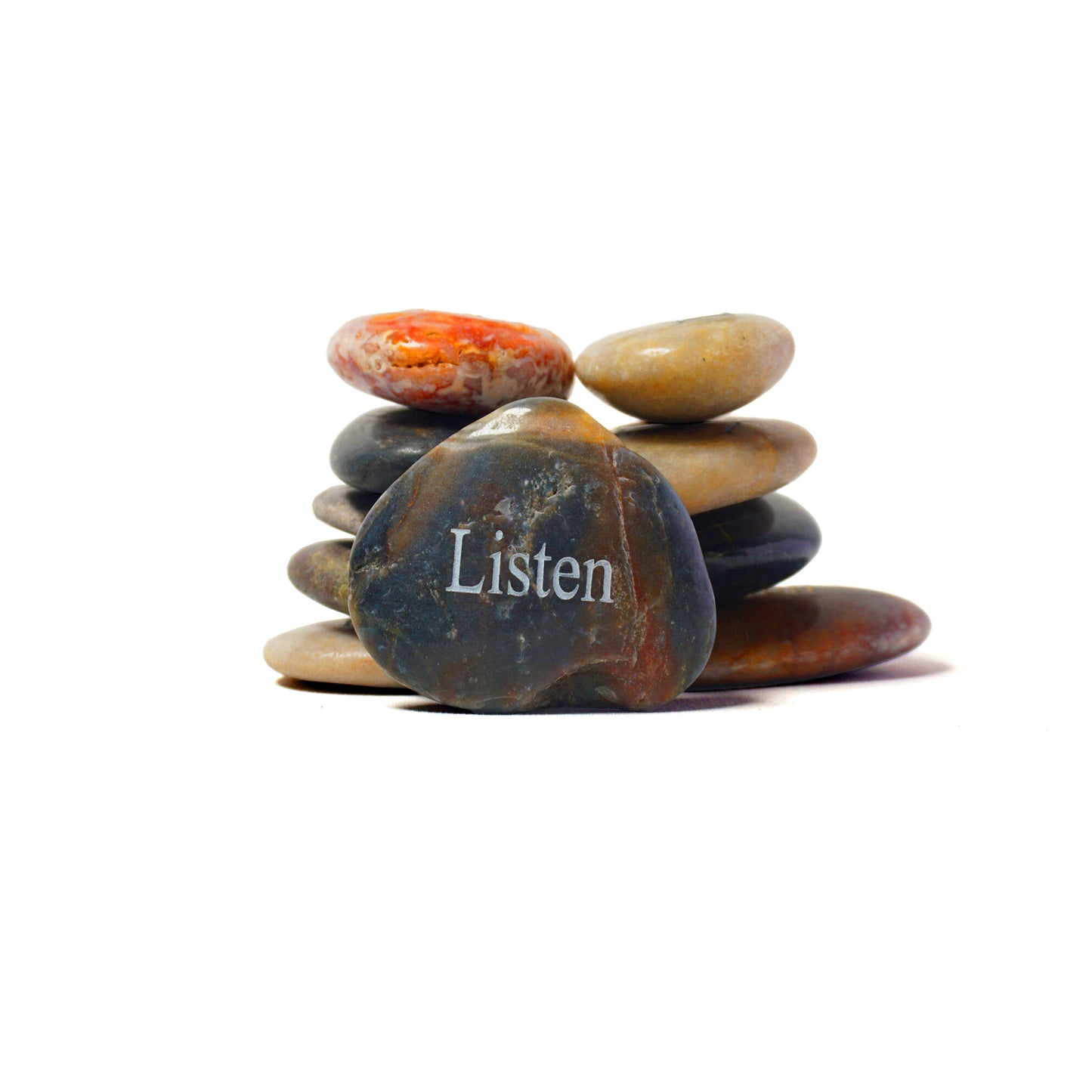 Stack of stones with a prominent stone labeled 'Listen' on a white background
