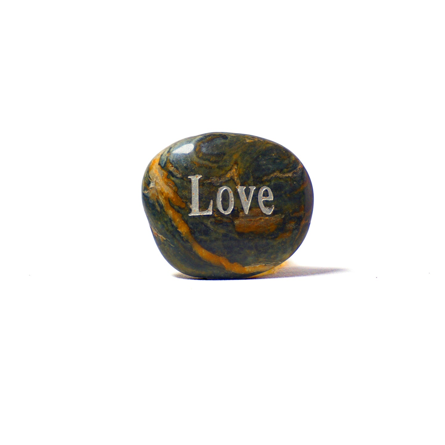 Marbled stone with 'Love' engraved on a white background