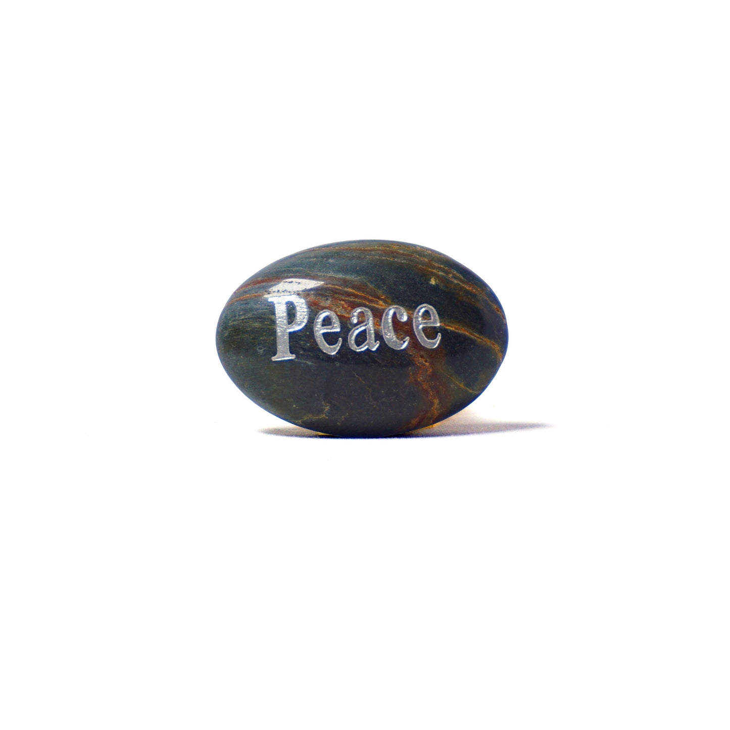 Decorative stone with 'Peace' engraved on a white background
