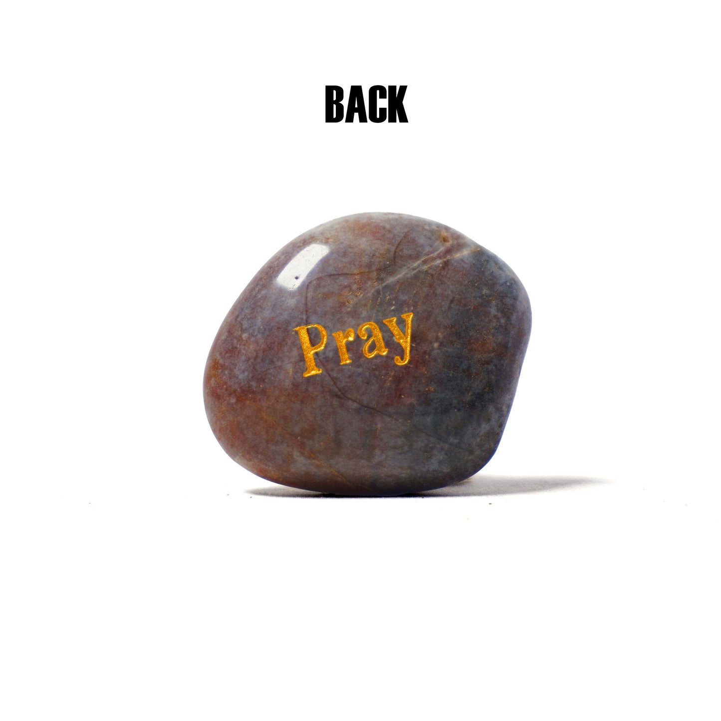 Brown stone with 'Pray' engraved on a white background