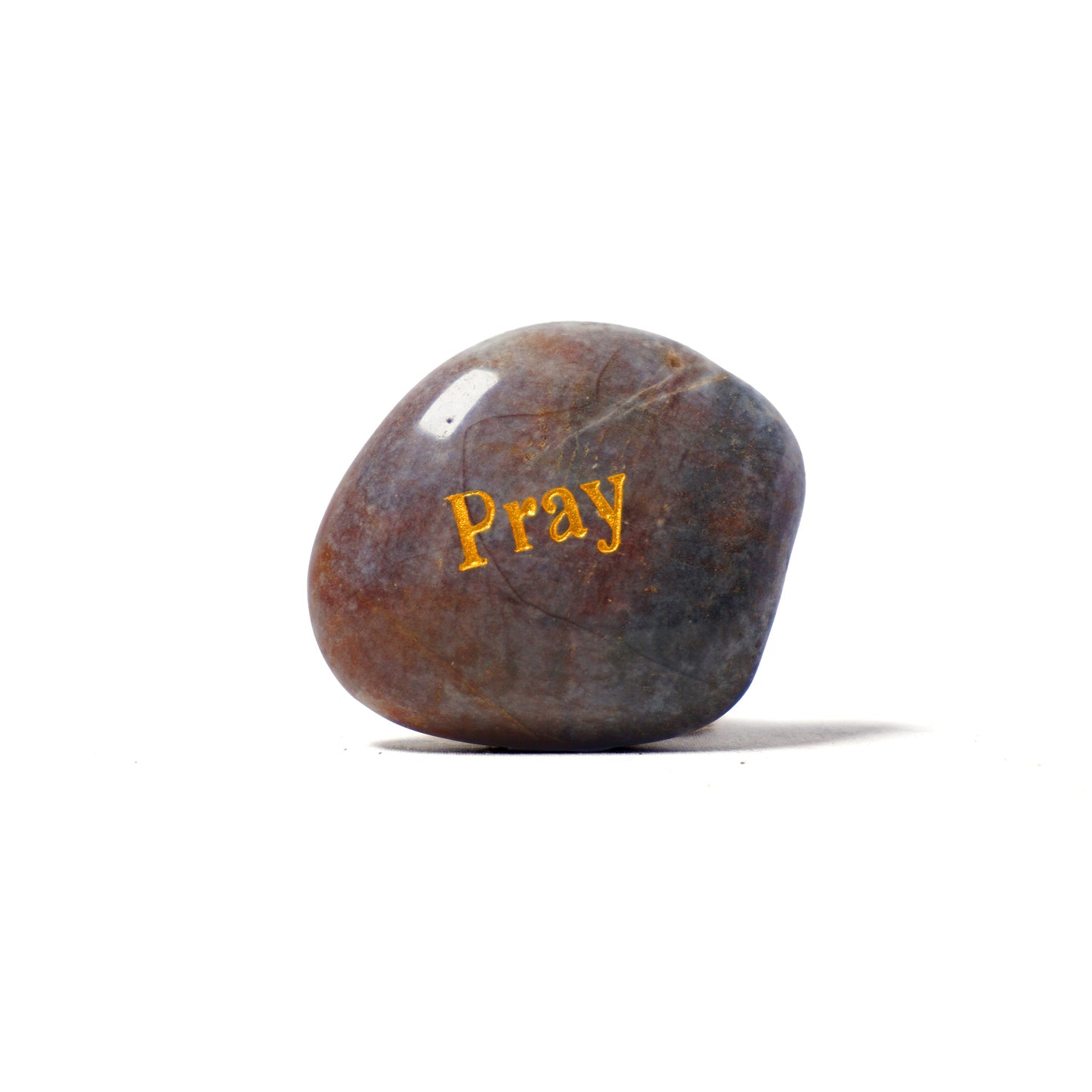 Brown stone with 'Pray' engraved on a white background