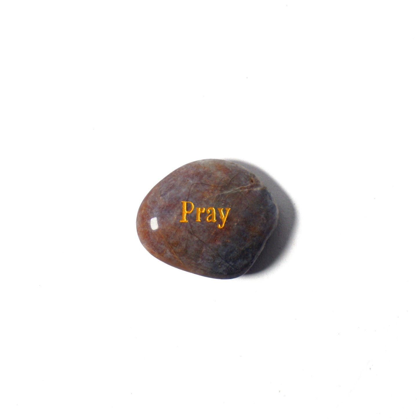 Brown stone with 'Pray' engraved on a white background