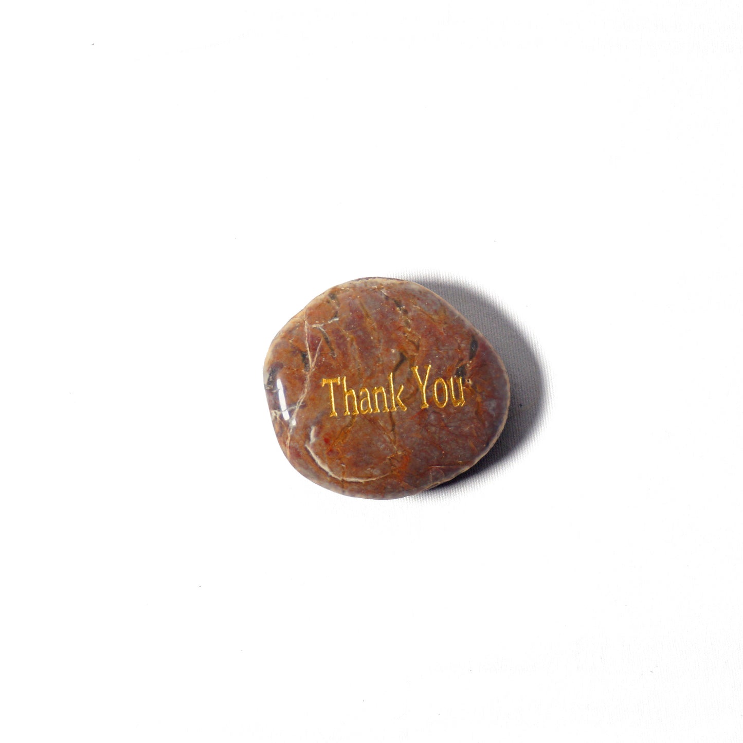 Round brown stone with 'Thank You' engraved on a white background