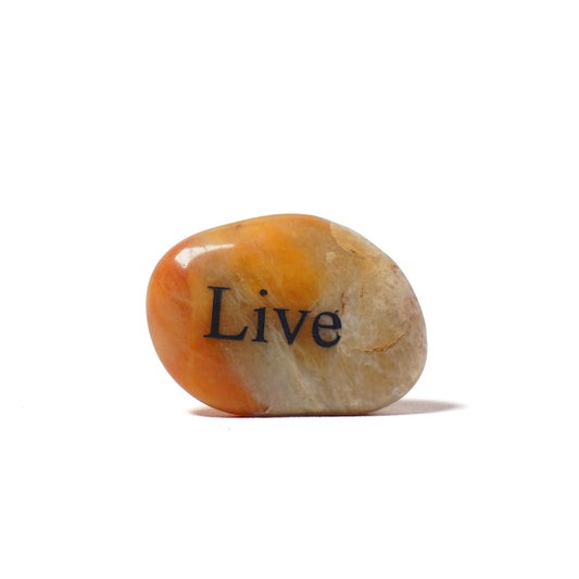 Decorative stone with 'Live' engraved on a white background