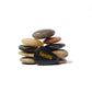 Stack of stones with 'Success' engraved on one of them against a white background