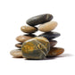 Stack of stones with 'Thank God' engraved on a white background