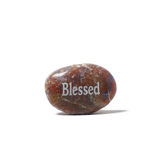 Brown stone with 'Blessed' engraved on a white background