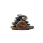 Stack of stones with a prominent stone labeled 'Change' on a white background