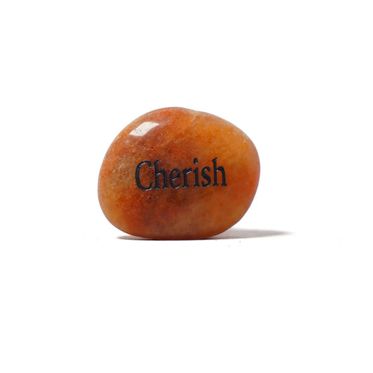 Orange stone with 'Cherish' engraved on a white background