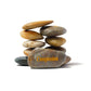Stack of stones with 'Compassion' engraved on a white background