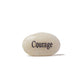 White stone with 'Courage' engraved on a white background