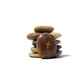 Stack of stones with a cross symbol on a white background