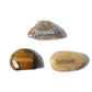 Three stones with 'Determination' engraved on them on a white background