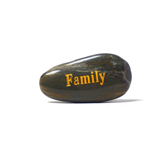 Decorative stone with 'Family' engraved on a white background