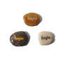 Three stones with 'Forgive' engraved on them on a white background