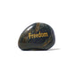 Black stone with 'Freedom' engraved in gold on a white background