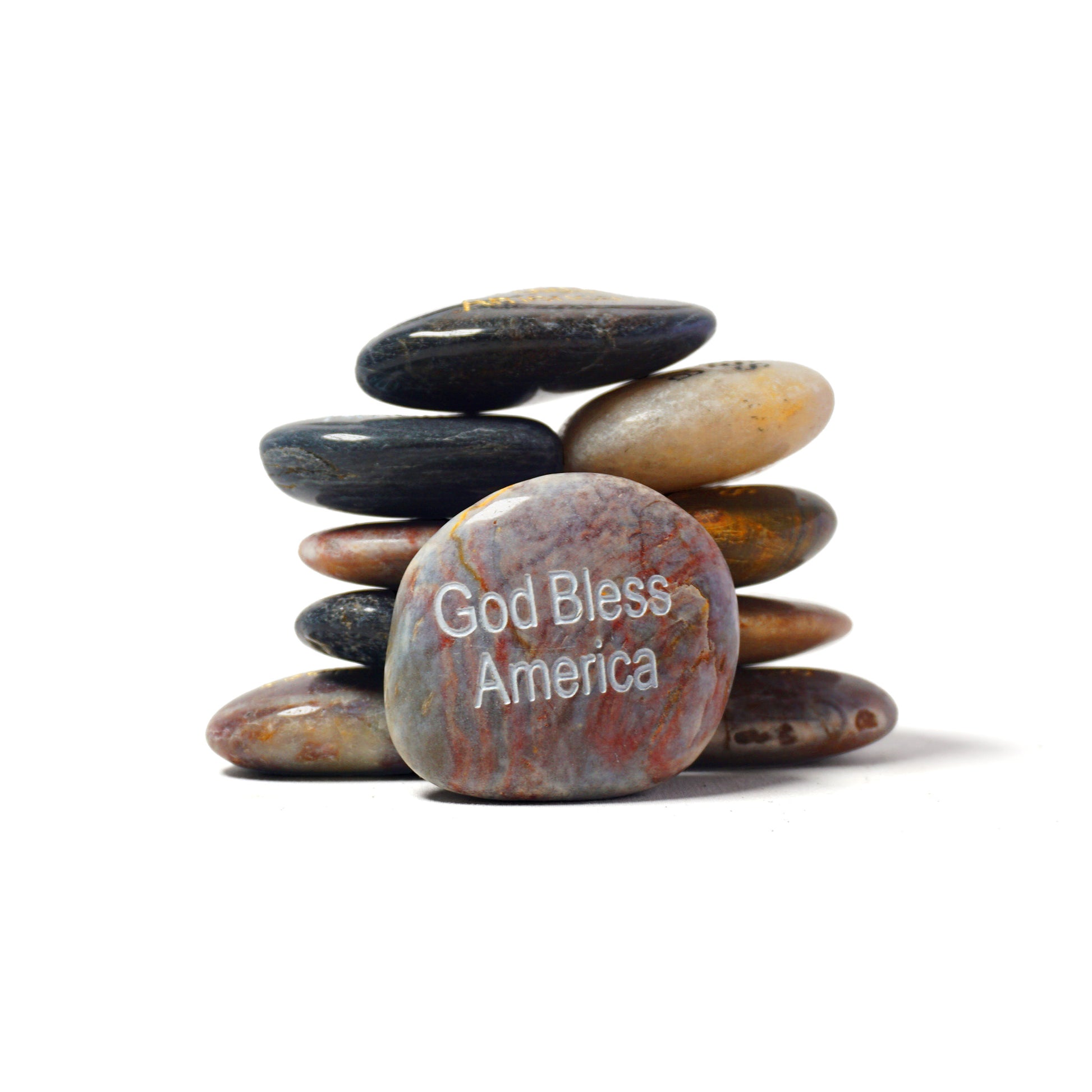 Stack of stones with 'God Bless America' engraved on a white background