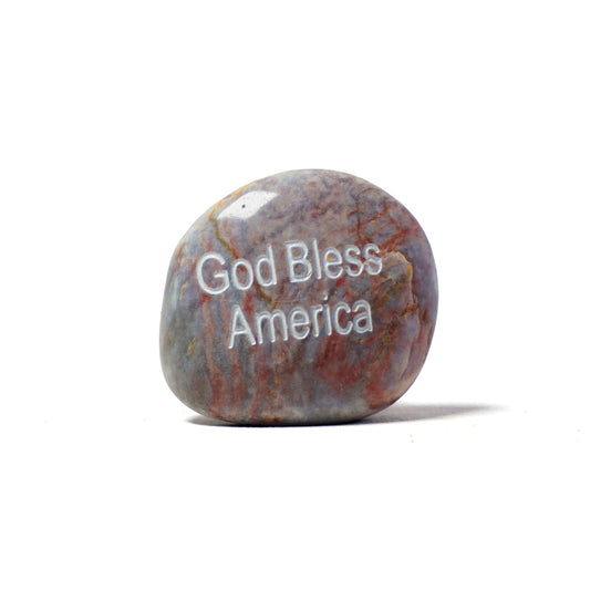Decorative stone with 'God Bless America' engraving on a white background