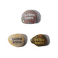 Three stones with 'God Bless America' engraved on them against a white background