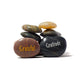 Stack of stones with 'Grateful' and 'Gratitude' inscriptions on a white background