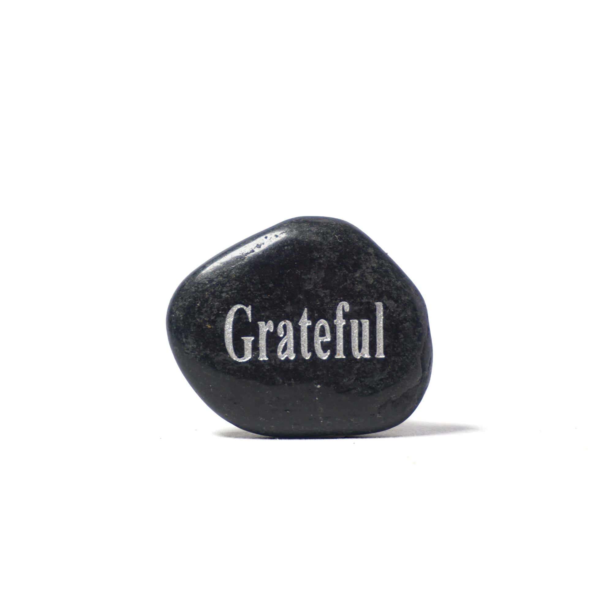 Black stone with 'Grateful' engraved on a white background