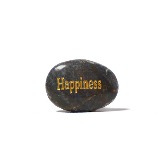 Black stone with 'Happiness' engraved on a white background