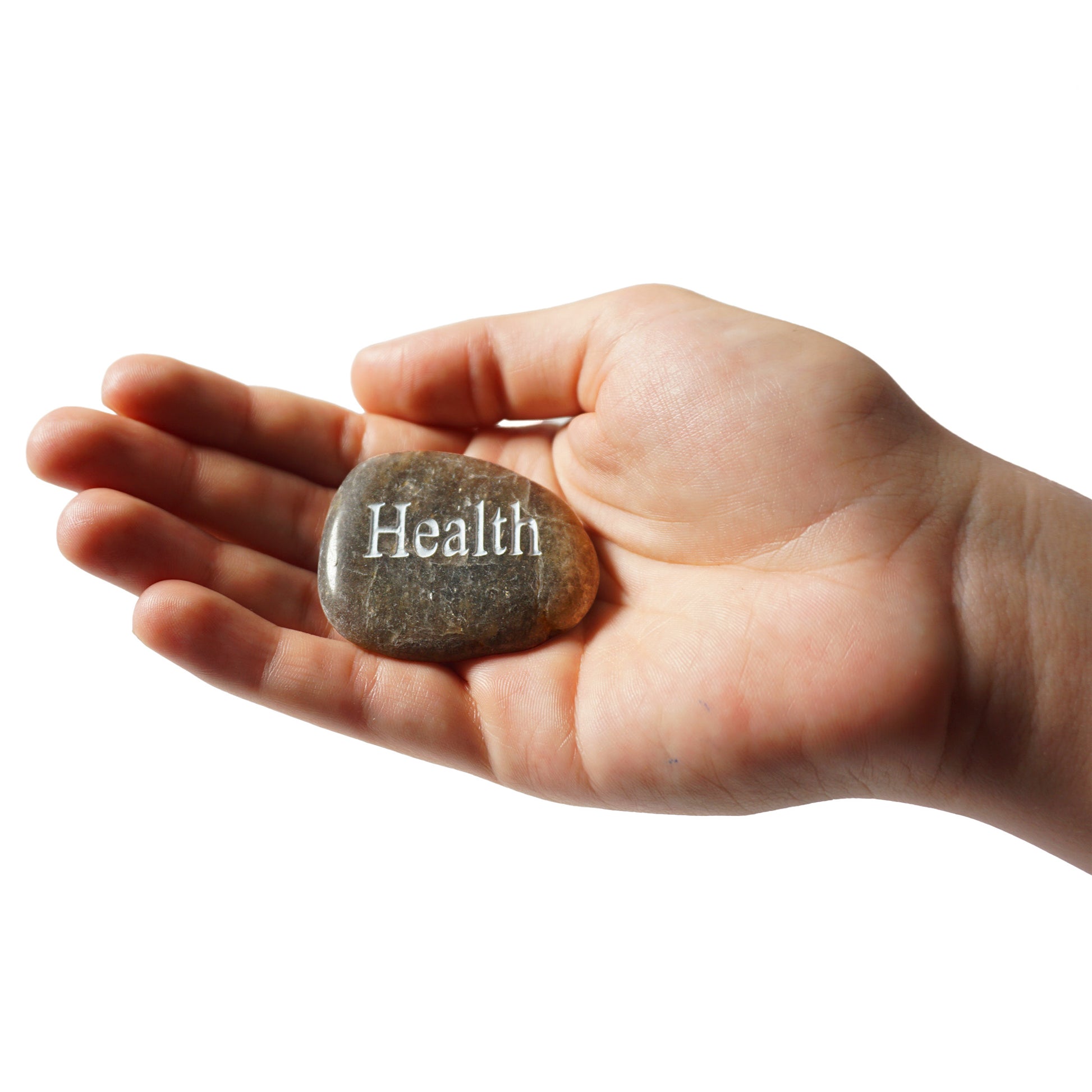 Hand holding a stone with the word 'Health' engraved on it against a white background