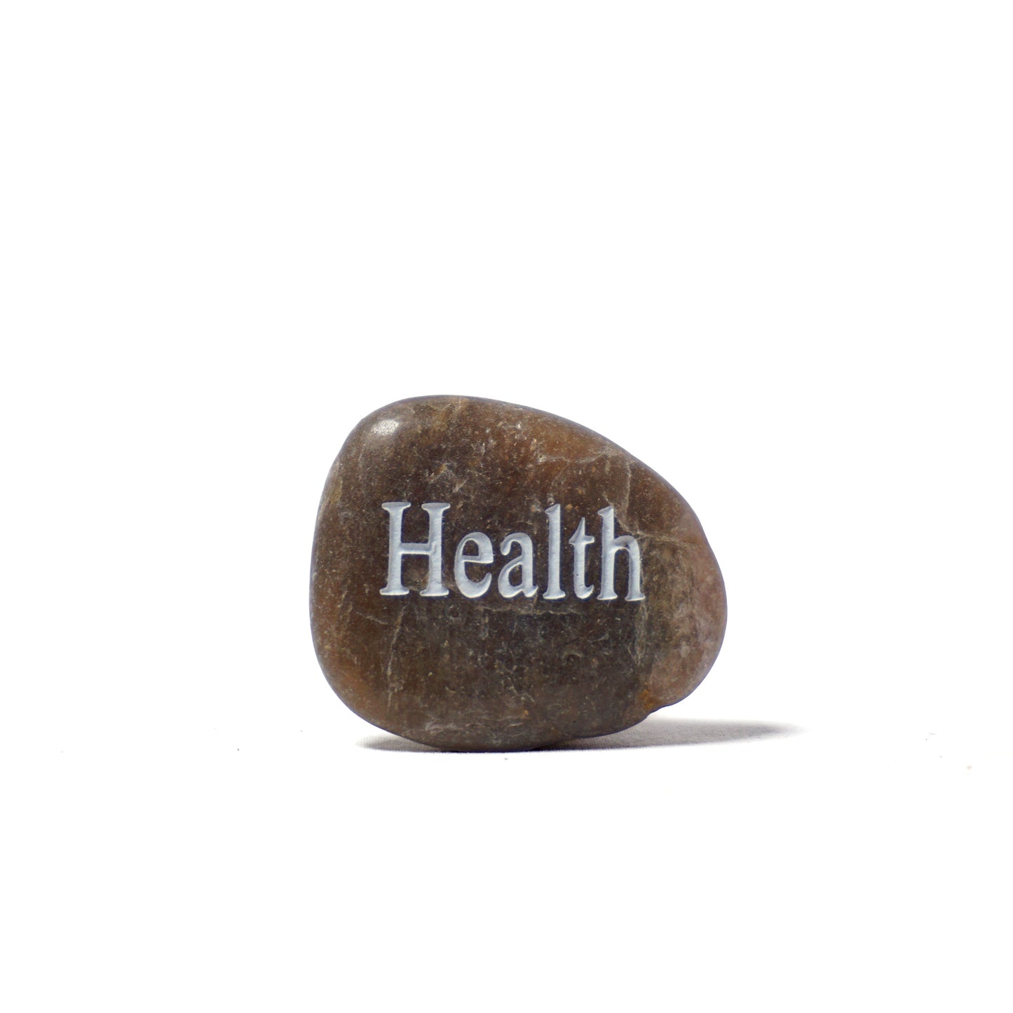 Brown stone with 'Health' engraved on a white background