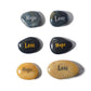Set of stones with 'Hope' and 'Love' inscribed on them, arranged on a white background.