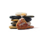 Stack of stones with a heart-shaped rock labeled 'Imagine' on a white background