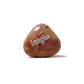 Brown stone with 'Imagine' engraved on a white background