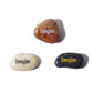 Three stones with 'Imagine' engraved on them on a white background