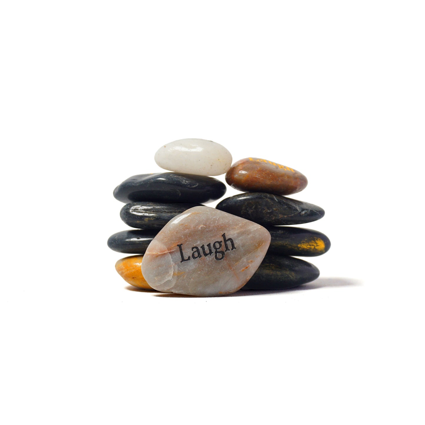 Stack of stones with a smaller stone on top, featuring the word 'Laugh'.