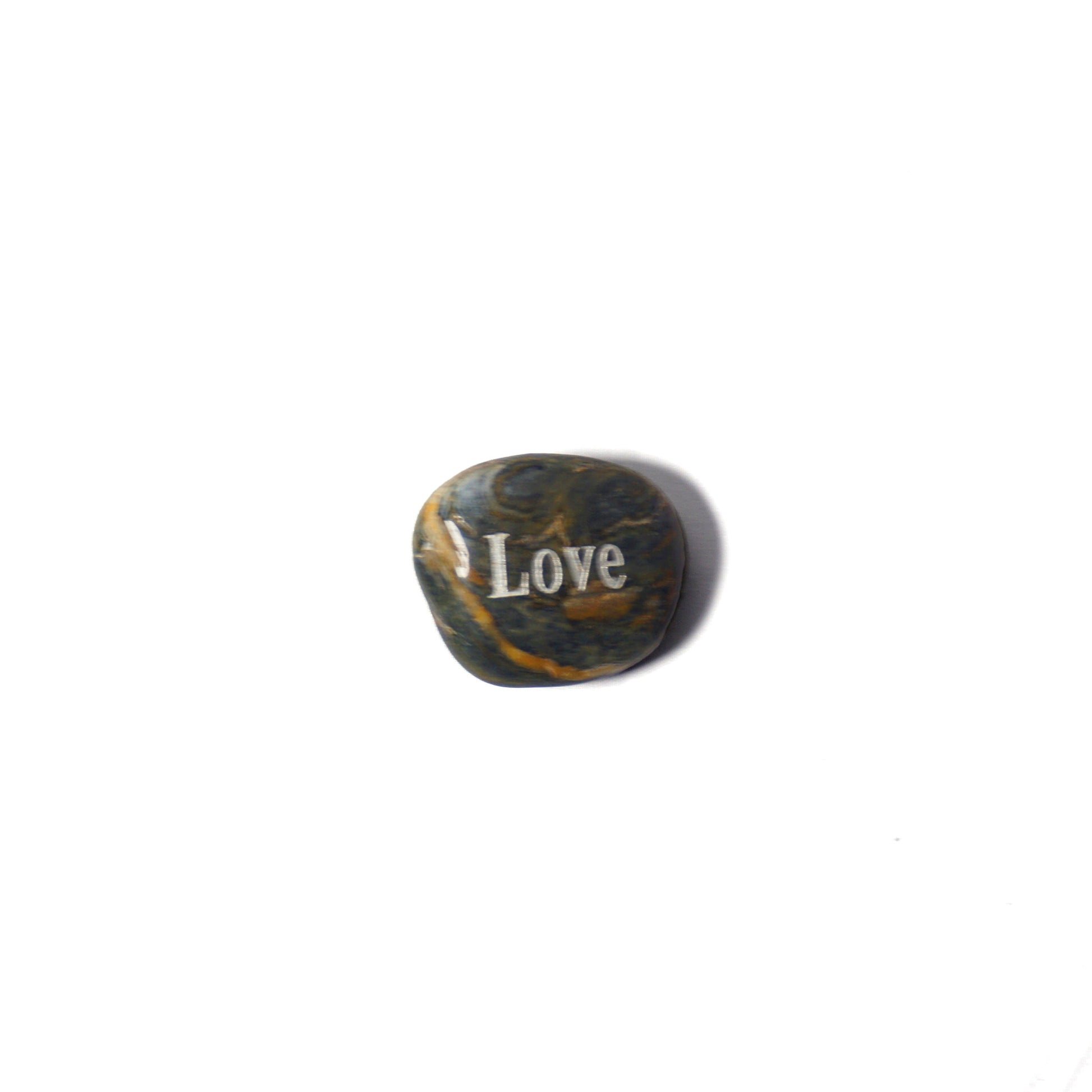 Decorative stone with 'I Love' engraving on a white background